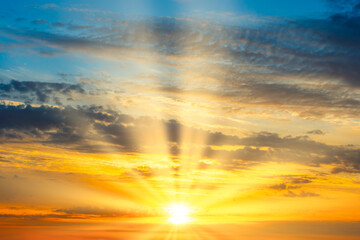 Sunset sky with sunset clouds, sun rays  and dramatic sky