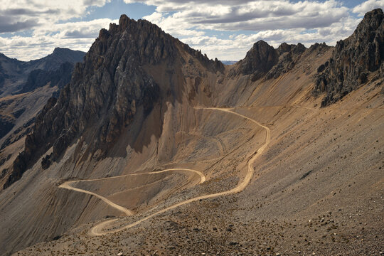 Craggy peaks and switchback dirt road