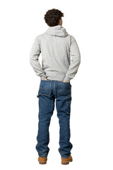 Young boy seen from behind in full body. Dressed in jeans and sweatshirt.