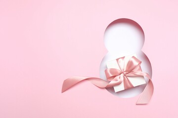 8 March greeting card design with gift box, top view. Happy International Women's Day