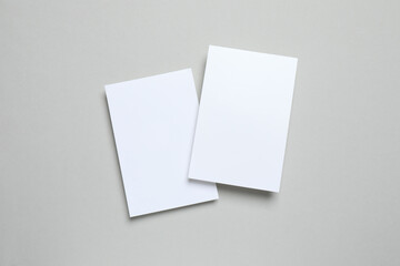 White paper cards on gray background