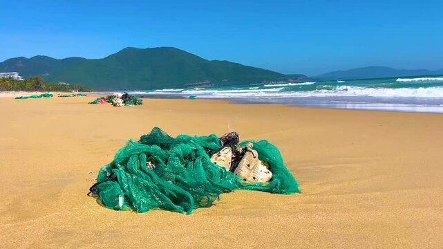 Plastic nets washed up on the beach, fish waste, pollution of the planet and oceans.