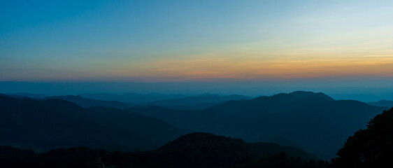 Natural landscape sunset sky on top of mountain and valleys.