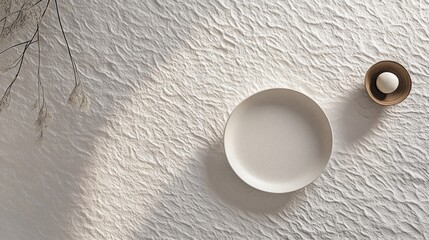 Minimalist table setting, sunlit textured surface, dried flowers, food blog