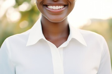 A happy woman posing with a smile for the camera, possibly for a photo shoot or selfie