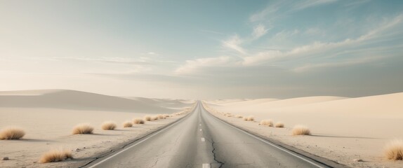 Fototapeta premium Long desert road leading towards a dramatic horizon.