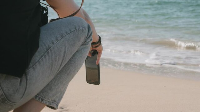 girl making videos of the sea