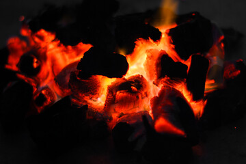 Smoldering embers of charcoal, preparation for barbeque. Charcoal background.