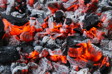 Smoldering embers of charcoal, preparation for barbeque. Charcoal background.