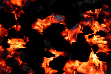 Smoldering embers of charcoal, preparation for barbeque. Charcoal background.