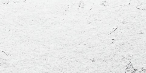 A textured, light-colored surface with subtle variations, creating a soft, neutral background ideal for various uses.