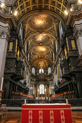 A beautiful view inside London's renowned St. Paul's Cathedral from the altar, looking towards the choir and the high altar in the background. The choir vaults are adorned with mosaics.