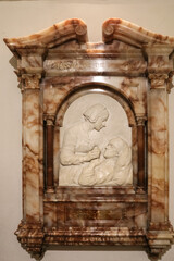 Close-up view of the sculpted marble and alabaster wall memorial with relief of Florence Nightingale by sculptor Arthur George Walker in the crypt of the St. Paul’s Cathedral, London.