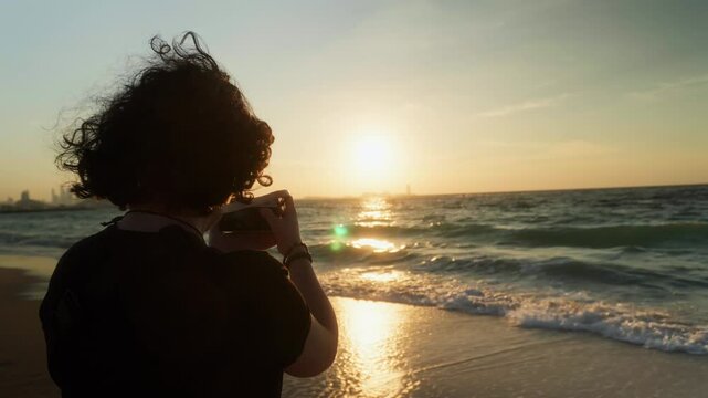Photographer taking pictures of sunset