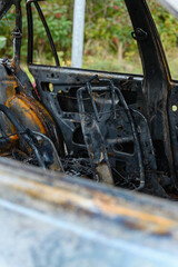 Burnt-out interior of a passenger car.
