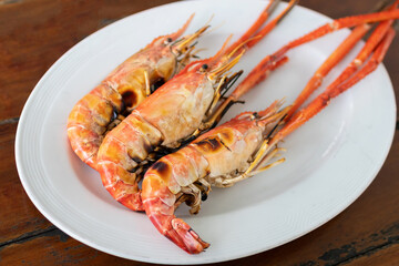 Charcoal grilled river prawns usually served with spicy seafood.