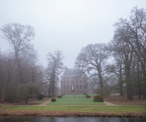 castle amerongen in dutch province of utrecht on misty winter day