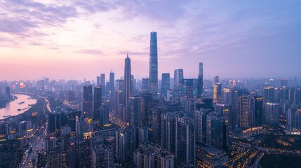 Fototapeta premium Illuminated Urban Splendor: Aerial View of Glowing Skyscrapers in the Evening Dusk