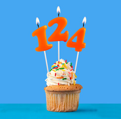 Orange birthday candle and cupcake - Number 124.