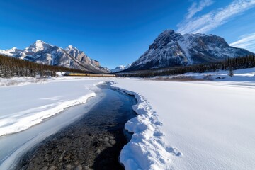 Obraz premium A stunning snowy landscape with majestic mountains and a train traversing the scenic route, capturing the essence of winter beauty and adventure in nature.