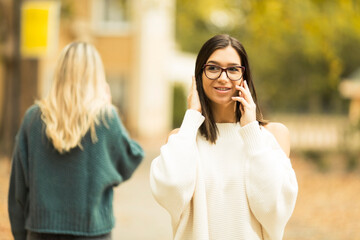 beautiful young woman talking on the phone