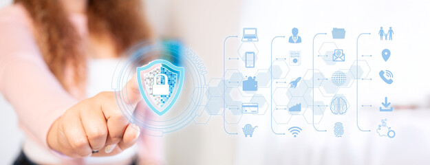 cybersecurity concepts. businesswoman interacts with hologram of business and family data security...