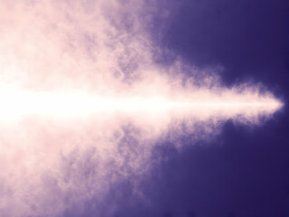 Fototapeta premium Abstract Light Beam Shines Through Pink and Purple Clouds Background