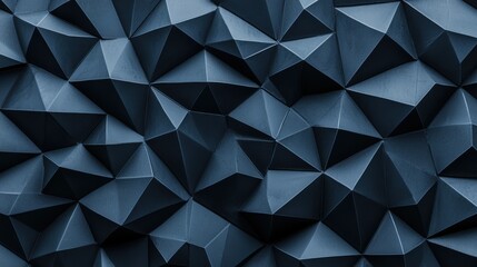 Obraz premium Abstract geometric background with three-dimensional triangular shapes in shades of deep blue, creating a modern and dynamic texture for design use