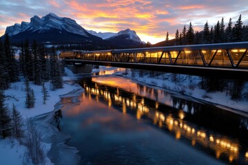 Obraz premium A majestic train glides over a mountain bridge during twilight, its golden lights reflecting on the water below, evoking a sense of adventure and exploration in nature's embrace.
