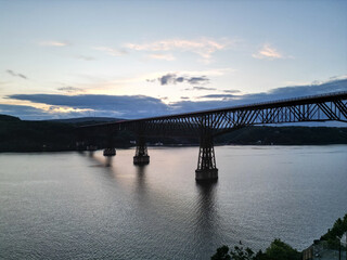 view of walkway over the hudson at sunset (tall former railroad bridge over the hudson river in...
