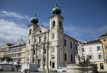 Obraz premium famous old church in gorizia italy (beautiful historic buildings in town square piazza) dome blue sky clouds history italian europe european