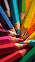 Naklejka premium Assortment of wooden colored pencils, close-up , wood, brown background