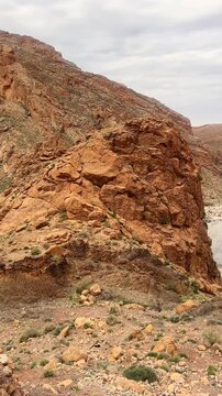 Canyon with river in Atlas Mountains with cliffs and rocks. Meski, Morocco. Vertical. Panorama