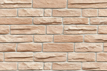 Fototapeta premium Light Brown Rough Stone Brick Wall Texture forms a Seamless Repeating Pattern