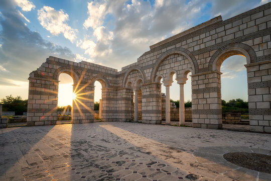 Fototapeta Colorful sunset above the ruins of the Great Basilica, which is the largest Christian cathedral in medieval Europe near Pliska - capital city of the First Bulgarian Empire, Bulgaria..