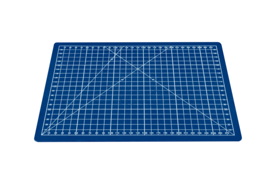 A small blue cutting mat with a white grid is isolated.