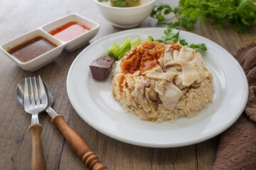Mixed Chicken and rice ,boied chicken with fried chicken and rice,coriander and cucumber with sauce and soup , hainanese chicken rice, thai called khao man gai, 