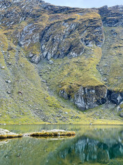 Balea Lake and its pristine alpine scenery. A concept of peaceful solitude and unspoiled wilderness.