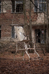 Abandoned gynecological chair on the street in Prypyat city, Ukraine.