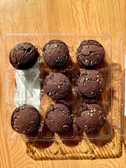 Top view of round oatmeal chocolate cookies in plastic packaging