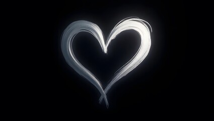 A sleek silver heart glowing against a rich black backdrop.

