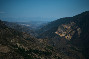 a view of the mountain road, city and mountains from the funicular near Tatev Monastery