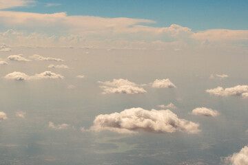 Aerial photograph of clouds outside of my airplane window on a cross country plane trip from Washington DC  to Austin Texas during a turbulent flight