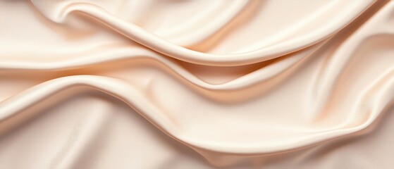 Obraz premium Smooth, luxurious fabric texture in soft beige tones.