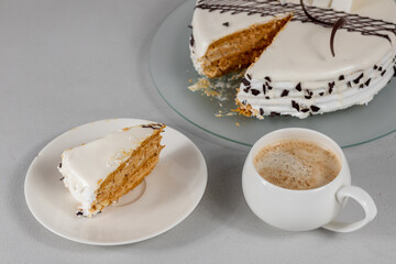 Slice of cake and cup of coffee on a table