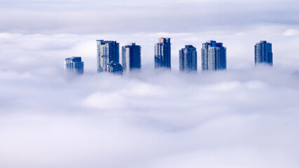 High-rise condos rising above Cloud inversion.