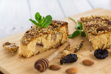 Homemade sponge cake with nuts and prunes