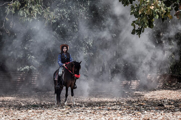 woman  riding a horse in farm.