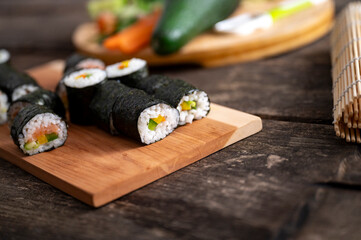 Delicious home made japanese cuisine sushi rolls with salmon fish and vegetables