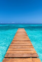 Obraz premium Serene Wooden Jetty Stretching into Calm Turquoise Waters on Beautiful Beach Day